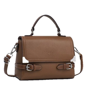 Brown leather women's satchel with top handle, adjustable strap, and silver hardware