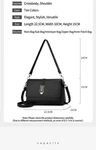Detailed view of black textured leather bag with dimensions 22.5x10x15cm and straps
