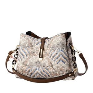 Jacquard bucket bag with landscape pattern, brown leather trim and gold hardware