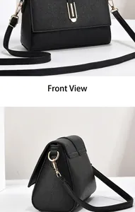 Detail of classic black lychee leather crossbody bag with golden metal buckle and strap
