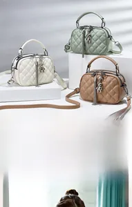 Close-up of quilted leather crossbody bags with bear charms and tassel zipper detail