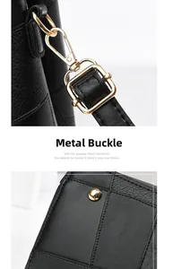 Close-up of golden metal swivel clasp and bottom studs on black stone pattern handbag