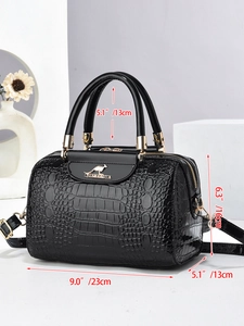 Detail of black glossy crocodile pattern bag showing precise dimensions of 23x16x13cm