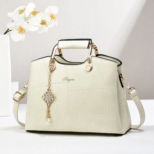 Elegant cream white handbag with geometric texture, metal handle and floral decoration