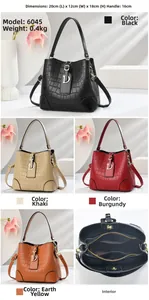 Detailed multi-color display of crocodile pattern bucket bags with metal D-buckle accents
