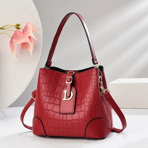 Elegant red crocodile pattern bucket bag with golden D-charm and handle