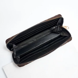 Classic patterned zip-around wallet with multiple card slots and gold hardware