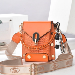 Orange faux crocodile leather mini crossbody bag with wide strap and golden hardware