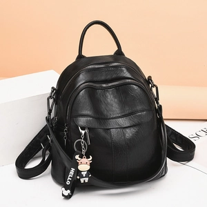 Damen Rucksack PU-Leder Litchi-Textur Mode Große Kapazität Schultertasche Mit Cartoon-Kuh-Anhänger Lässig Reisen Schule Tasche