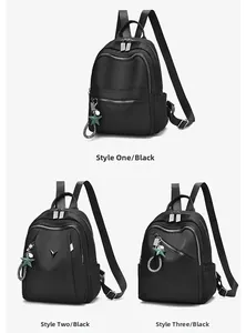 Tres modelos de mochilas de viaje en nailon negro con colgantes de estrella y cremalleras