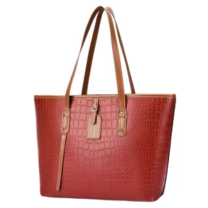 Red crocodile pattern PU leather tote bag with brown handles and embossed texture