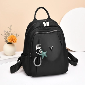 Grand sac à dos de voyage noir en tissu Oxford pour femme avec logo en V et pendentif étoile