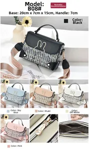 Detail view of stylish crossbody bag with metal bunny ears and wide MHDR strap