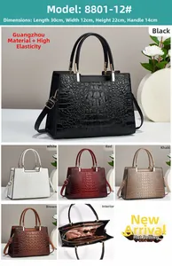 Detailed view of crocodile pattern handbag with size 30x12x22cm and hardware accents