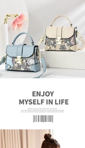 Detail of bohemian floral print handbag with gold buckle and adjustable strap
