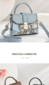 Detail view of stylish printed handbag with metal clasp lock and adjustable strap
