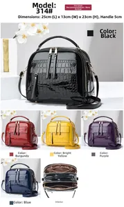Detailed view of the multi-compartment structure and crocodile texture of the tote bag