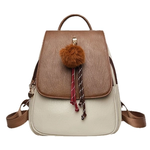 Chic beige and brown leather backpack for women with contrast panel and pompom charm