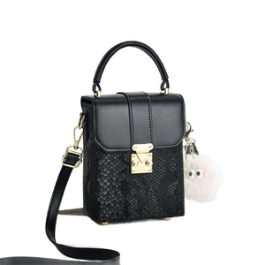 Elegant black snake pattern box bag with gold buckle and cute furry ball pendant