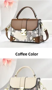 Detail of vintage paisley printed handbag with premium leather trim and gold buckle