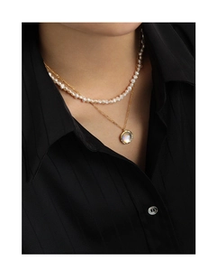 Close-up of double-layer S925 silver necklace with white pearls and moonstone pendant