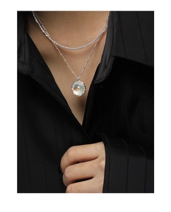 Detail of S925 sterling silver double-layered necklace with iridescent moonstone pendant