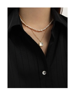 Close-up of double-layered S925 silver necklace with white pearls and moonstone pendant