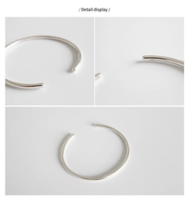 Detaillierte Makroansicht des S990 Sterlingsilber Armreifs mit polierter Oberfläche