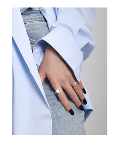 Detail of S925 silver rings with synthetic moonstone and pave cz on model hand