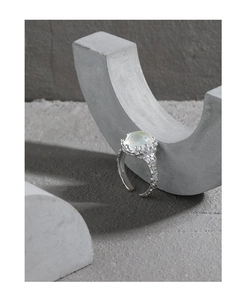 Detailed close-up of S925 silver ring featuring moonstone and lava texture design