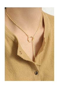Detailed close-up of golden S925 silver Lariat necklace with OT toggle buckle on model