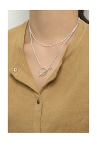 Detail of S925 sterling silver double layer necklace with OT buckle toggle on model