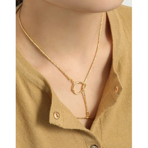 Elegant S925 sterling silver gold-plated OT buckle necklace on model's neck