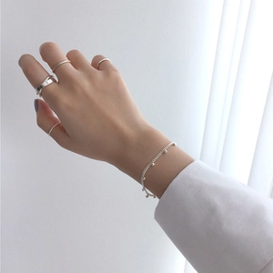 Minimalist S925 sterling silver jewelry set featuring four rings and one bead bracelet