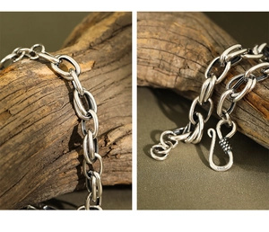 Detailed close-up of S925 sterling silver chain link and S-hook clasp with engraving
