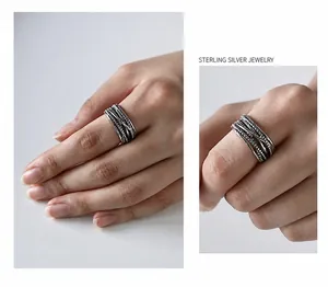 Macro detail of multilayer twisted rope S925 sterling silver vintage wide band ring
