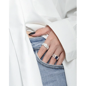 Irregular textured S925 silver ring set with large blue zircon on model hand