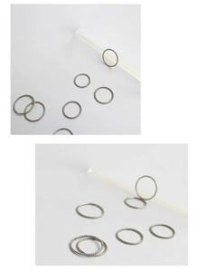 Macro detail of vintage S925 sterling silver twisted rope rings with oxidized finish
