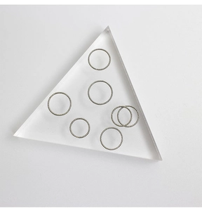 Close-up of stackable S925 sterling silver twisted rope rings on acrylic blocks