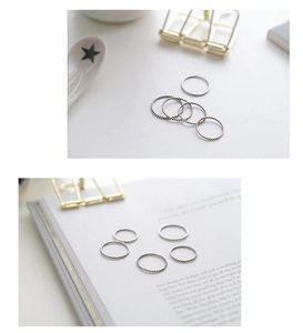 Macro detail of retro twisted rope rings in S925 sterling silver for stacked wearing