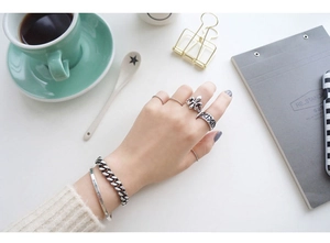 Detail of vintage S925 sterling silver twist rings and retro jewelry set for women