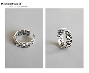 Detailed close-up of S925 sterling silver hallmark on vintage braided twist ring