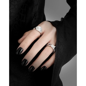 S925 sterling silver rings with lava texture and opal stones on model with black nails