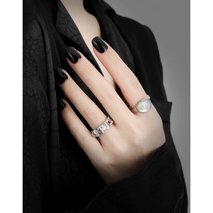 S925 sterling silver rings set with irregular textured band and opal stone on hand