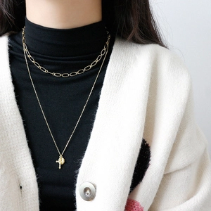 Layered gold S925 sterling silver necklace with cross and round relief pendants
