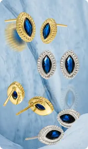 Macro detail of S925 sterling silver studs with marquise-cut blue zircon and bead edge