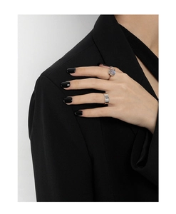 Close-up of minimalist S925 silver ring set with round labradorite on fashion model hand