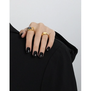 Minimalist S925 sterling silver gold ring with oval labradorite on model in black blazer