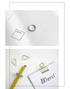 Detail of vintage S925 sterling silver twisted rope ring displayed on a pencil background