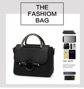Detail of lychee pattern leather bag with gold metal handle and spacious interior
